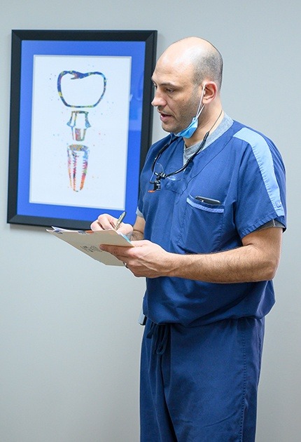 Dr. Mykle Jacobs talks to patients about upcoming procedures at LaGrange Oral Surgery and Implant Center.
