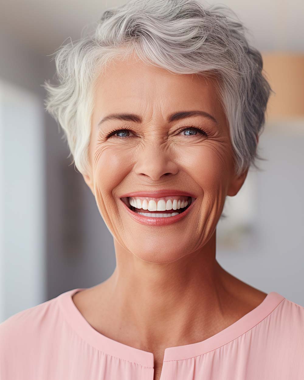 A woman smiles after receiving All-on-4 dental implants in LaGrange, Georgia from LaGrange Oral Surgery and Implant Center.